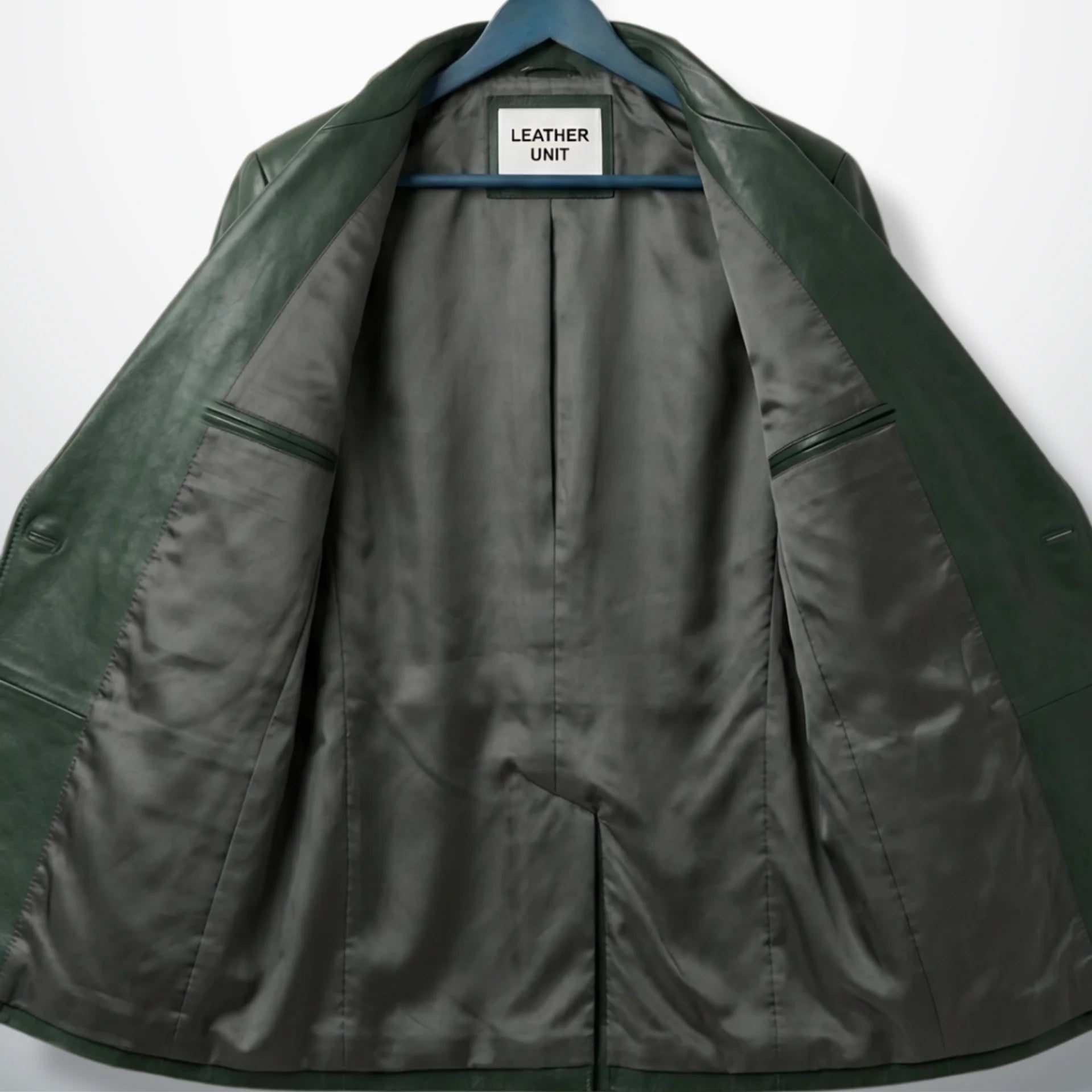 Inside lining of men’s green leather blazer showing inner pockets