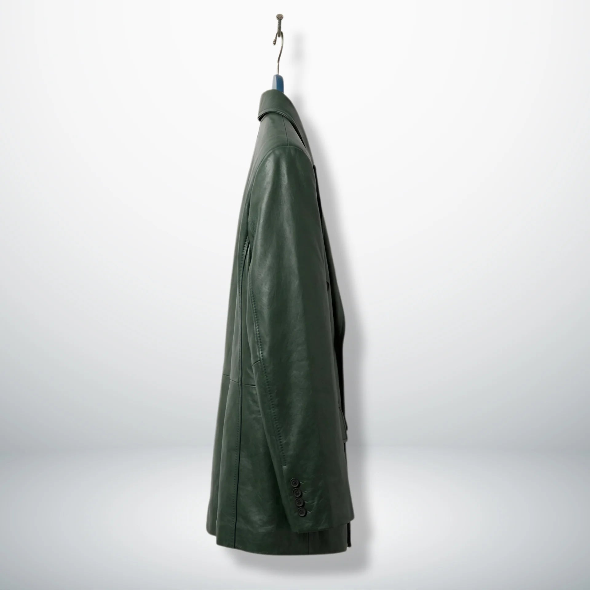 Side profile of men’s dark green leather suit blazer on hanger