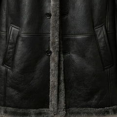 Button front and hand‑warmer pockets on men’s grey shearling leather coat