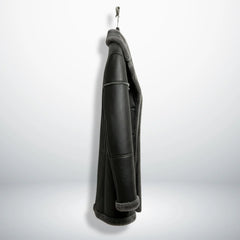 Side profile of men’s long grey shearling leather jacket showing length