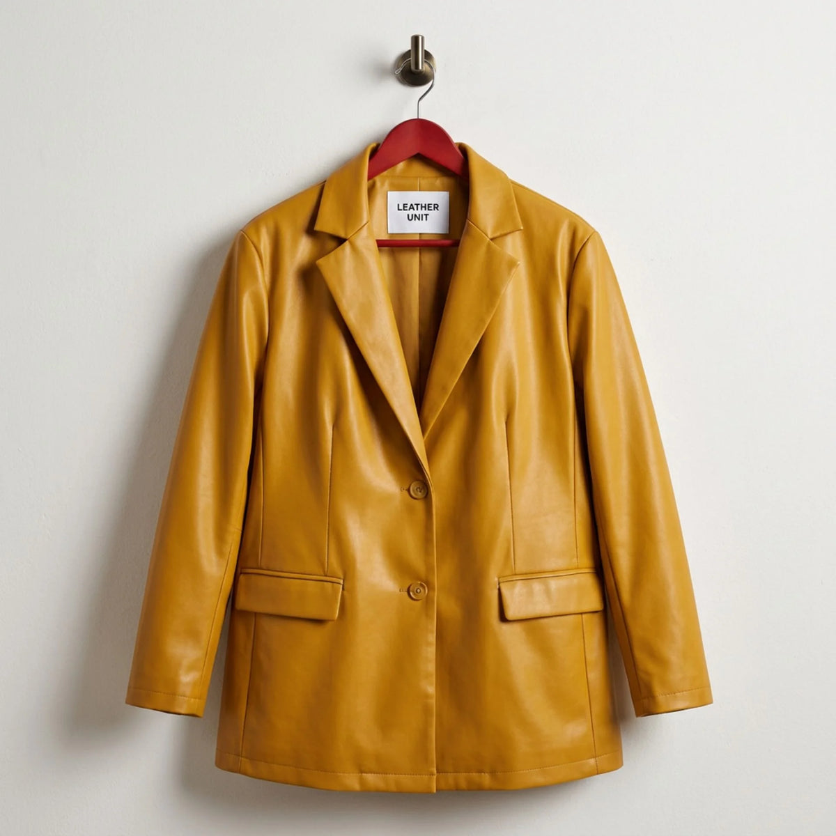 Front view of mustard yellow women’s vegan leather blazer by Leather Unit