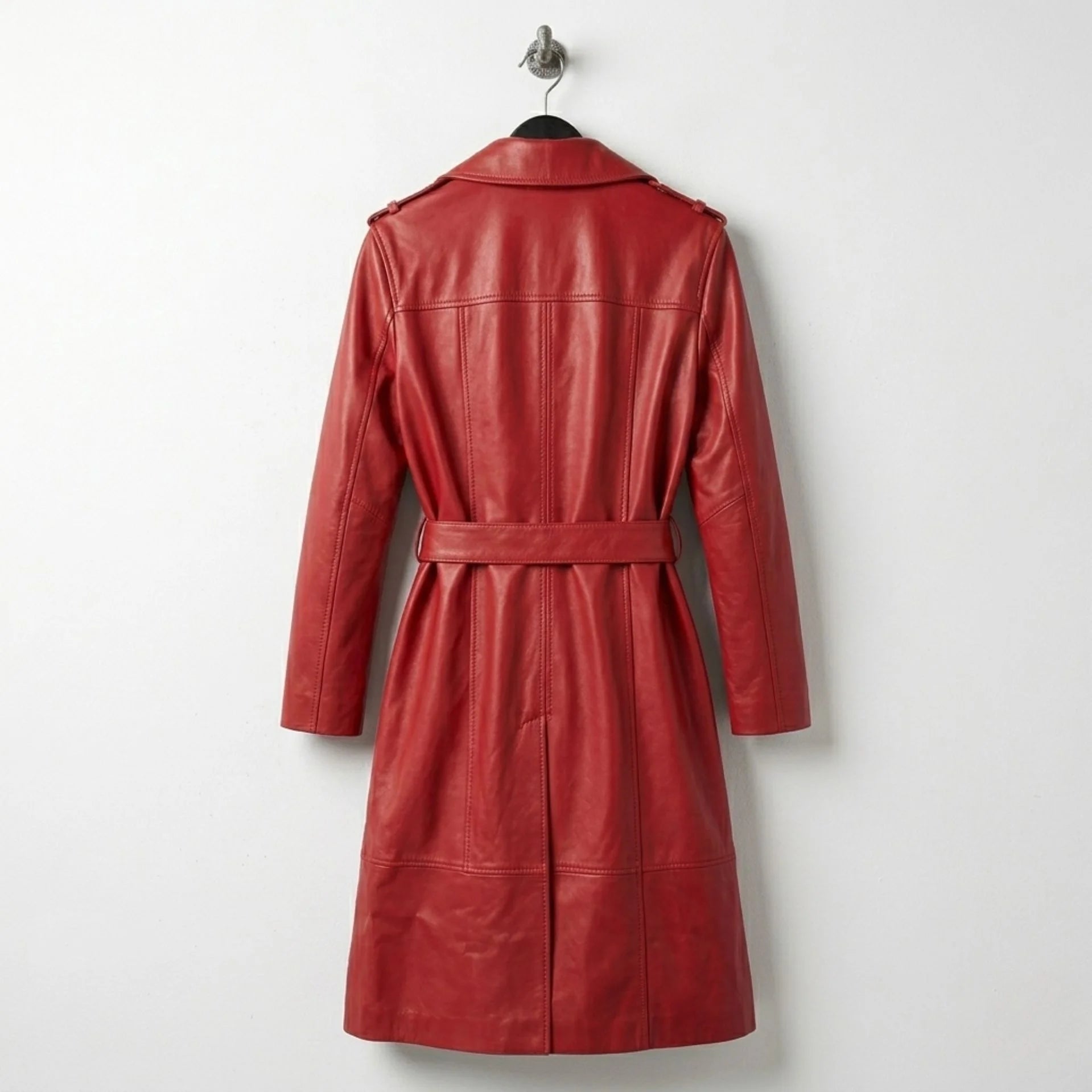 Back view of long belted red leather trench coat with tailored seams