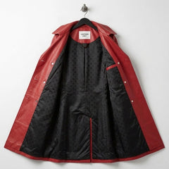 Inside lining of red leather trench coat showing black patterned interior