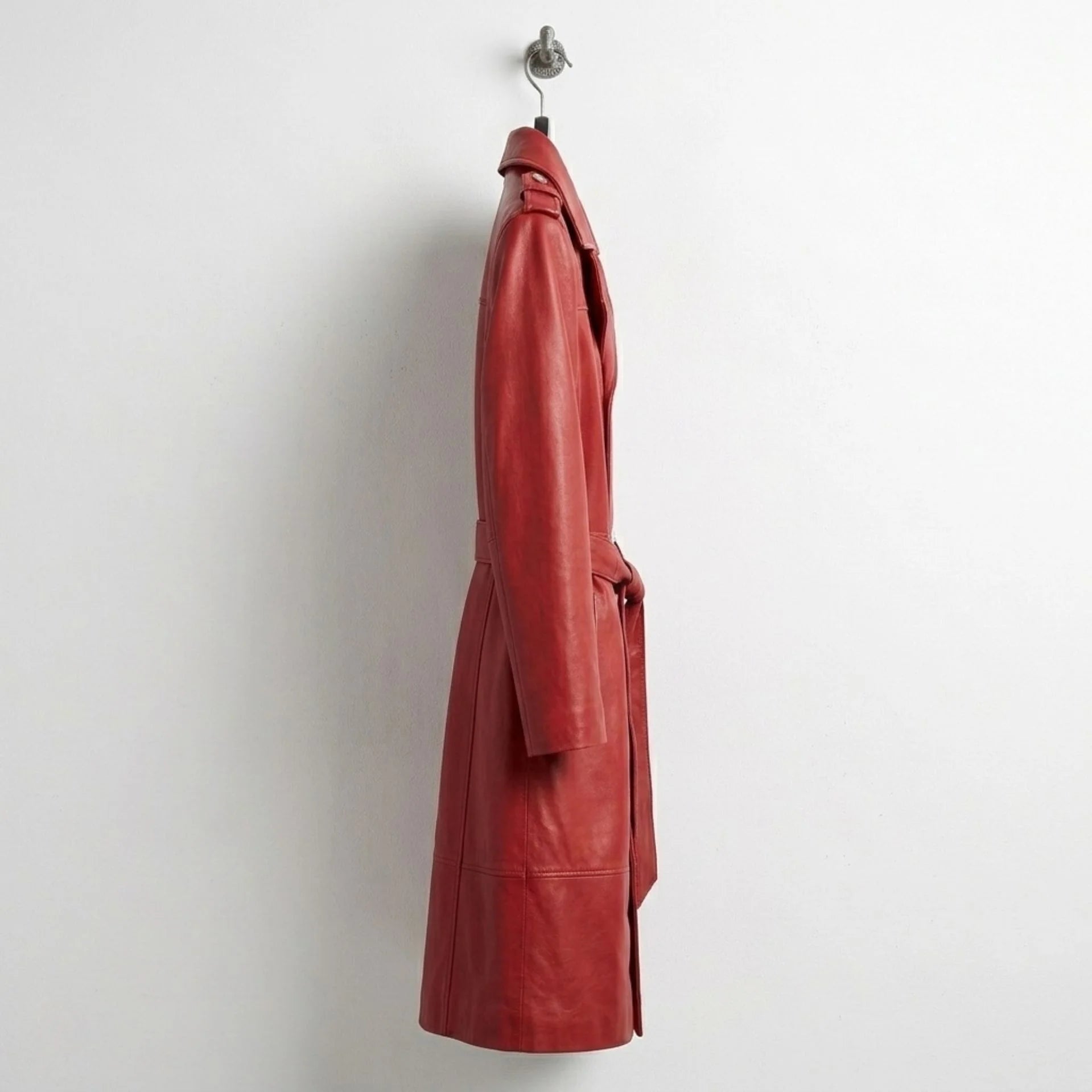 Side profile of full‑length red leather trench coat for women