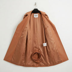 Inside lining of tan leather trench coat showing belt and inner panels