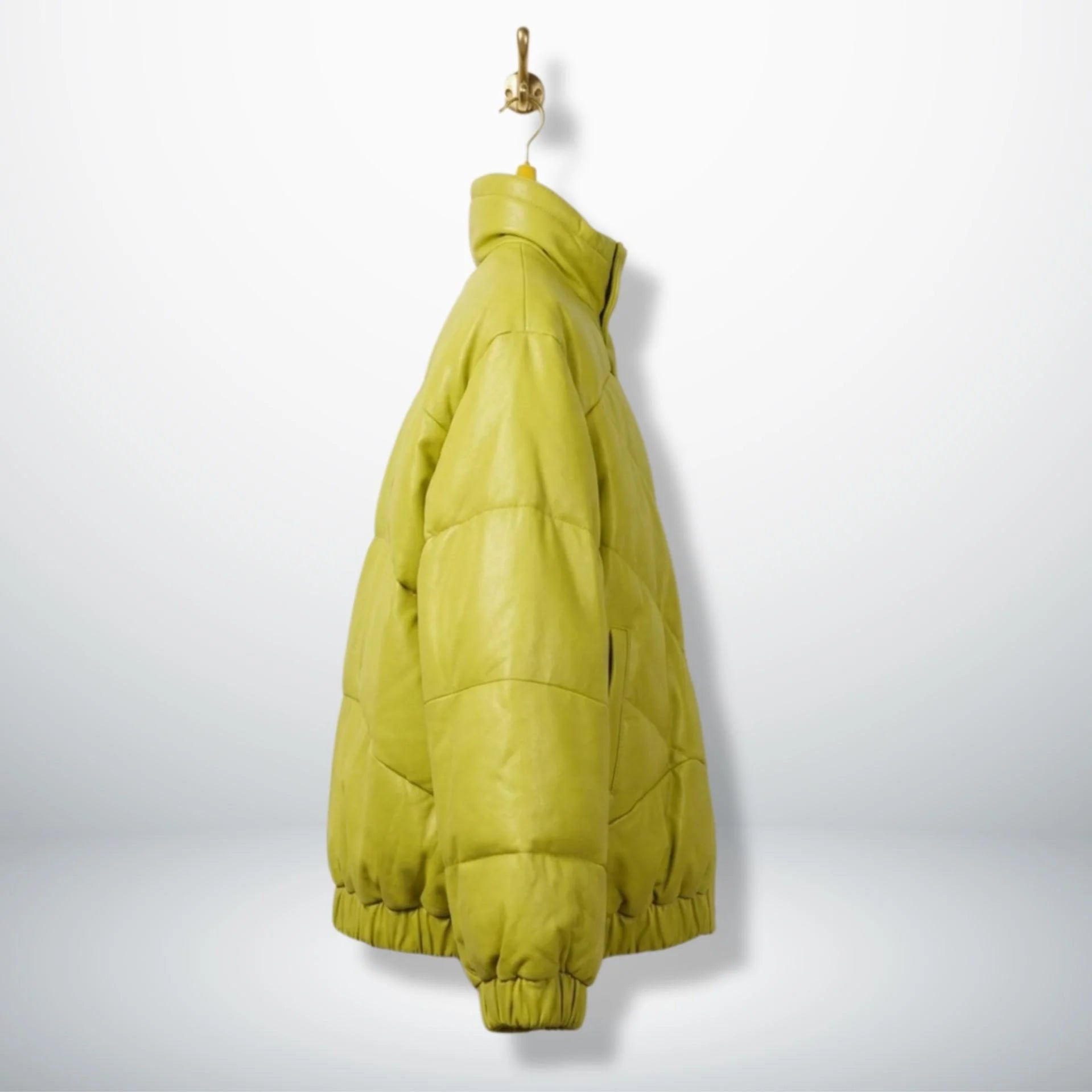 Side profile of unisex neon lime leather puffer jacket with stand collar