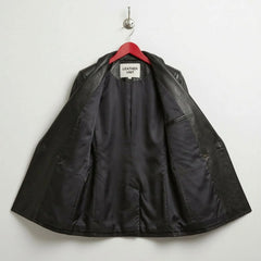 Interior lining of women’s black leather blazer with inner pocket