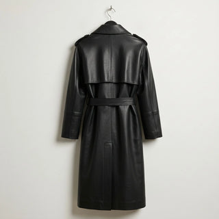 Back view of belted black leather trench coat with storm flap