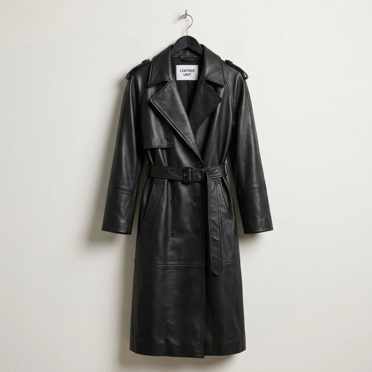 Front view of women’s long black leather trench coat by Leather Unit