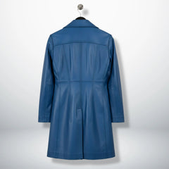 Back view of tailored women’s blue leather long coat with panel seams