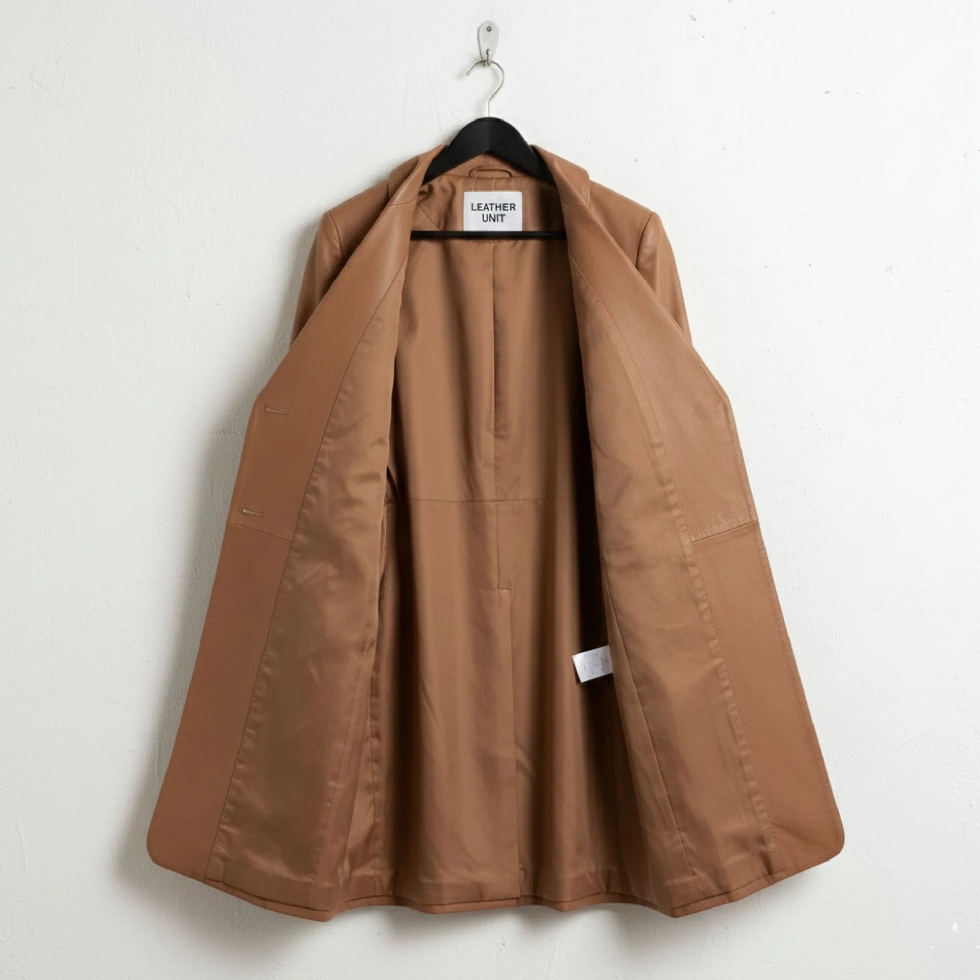 Inside view of fully lined camel brown leather long coat for women