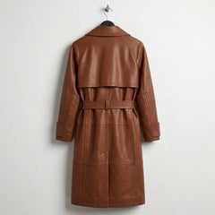 Back view of long belted brown leather trench coat with storm flap