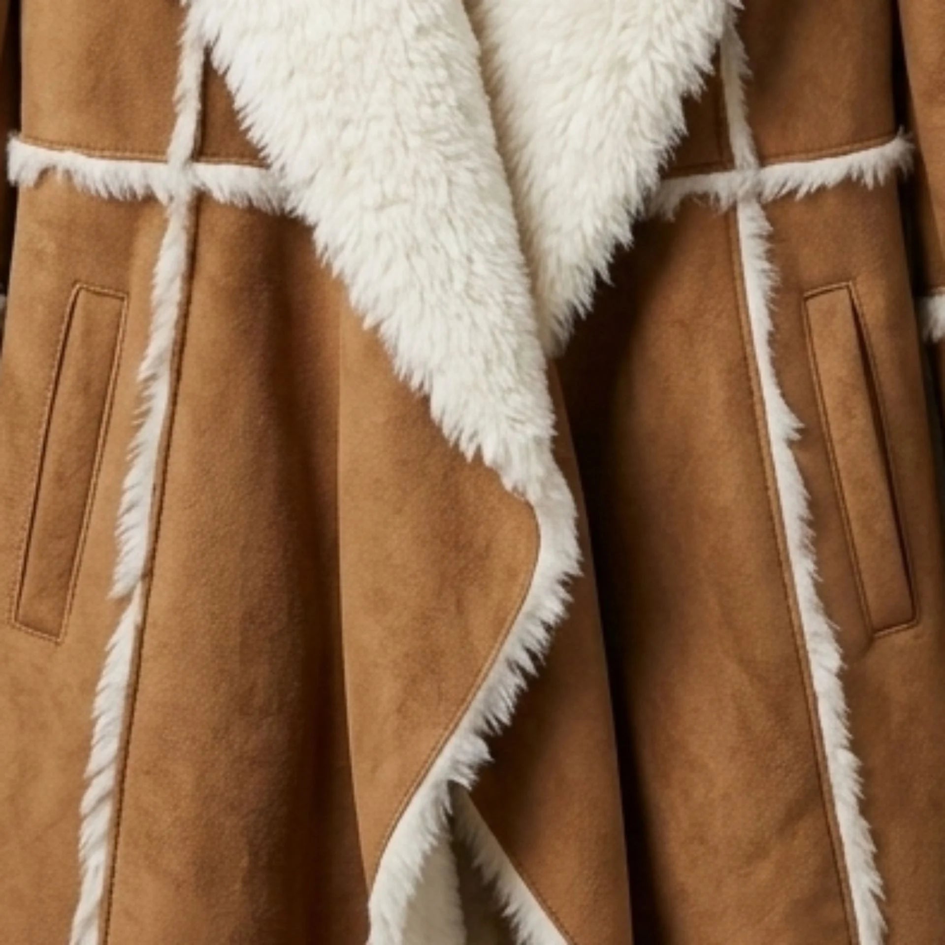 Open front and pocket detail on women’s brown fur lined suede overcoat