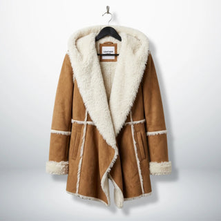Front view of women’s brown suede shearling hooded coat by Leather Unit