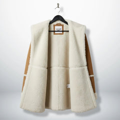 Inside view of fully shearling lined brown suede hooded coat for women