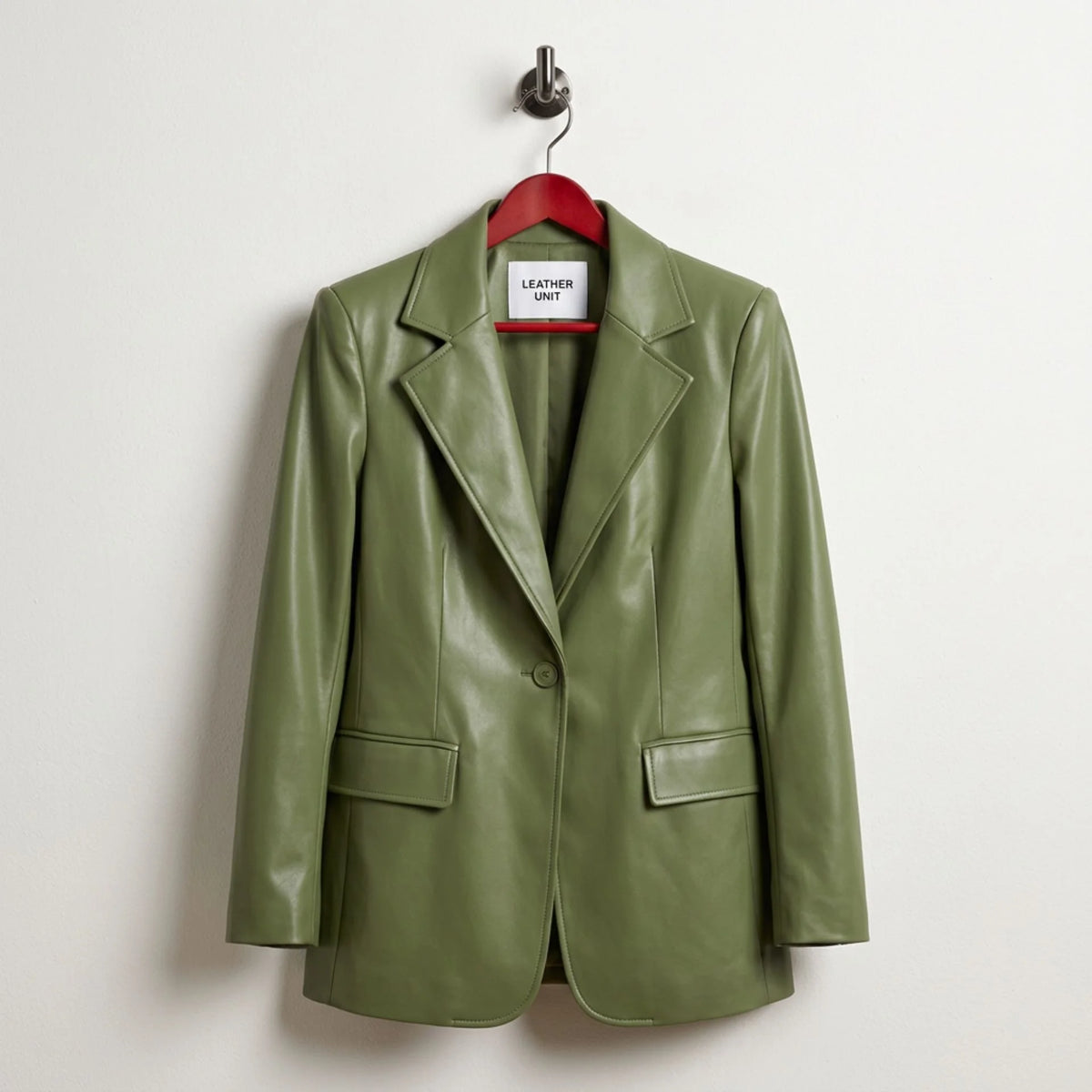 Front view of women’s verdant green leather blazer by Leather Unit