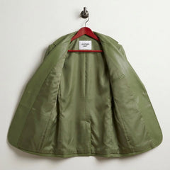 Interior lining of women’s green leather blazer with inner pocket