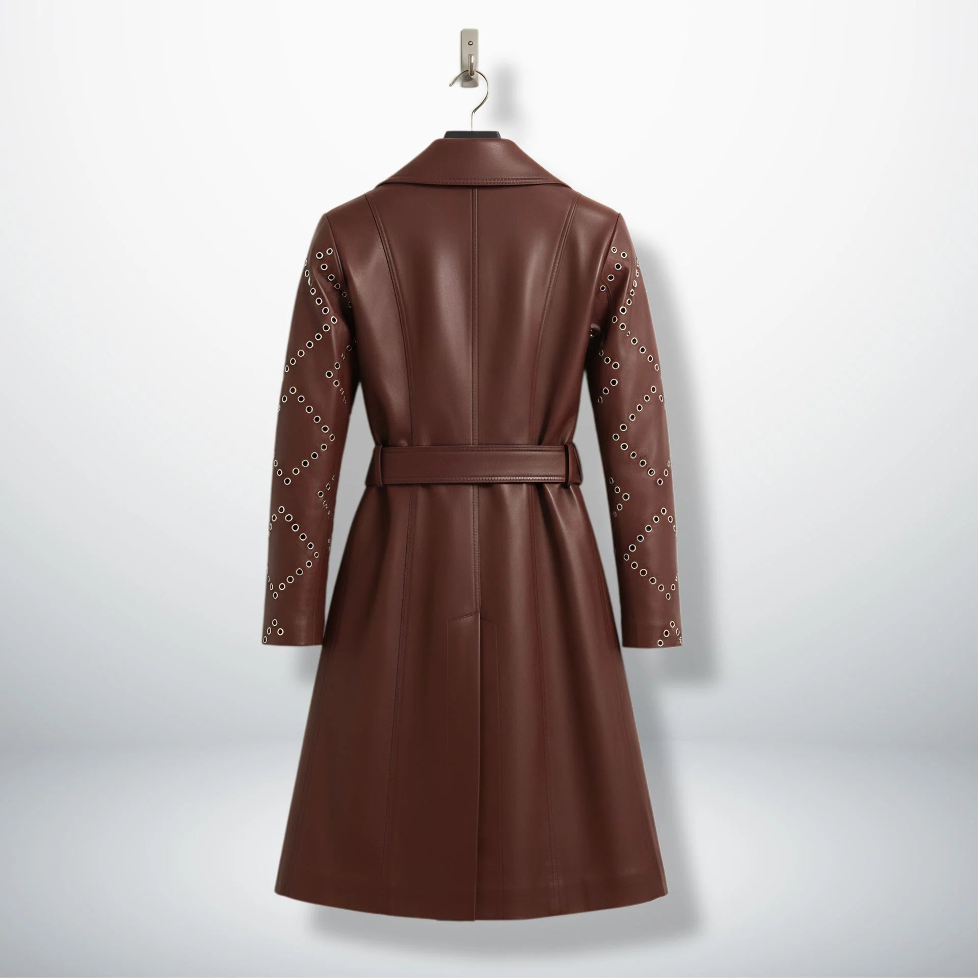 Back view of long maroon leather trench coat with belt and studded sleeves