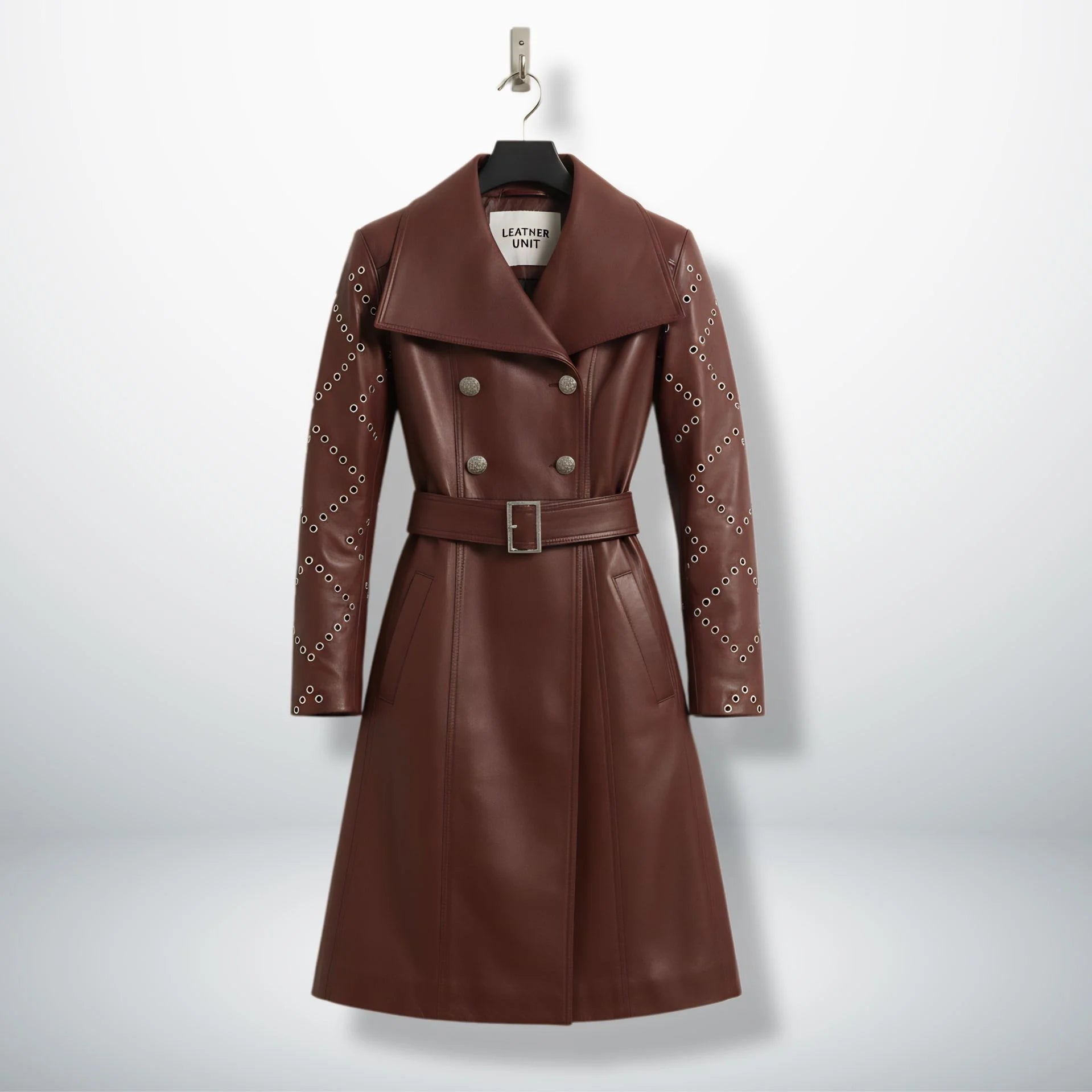 Front view of women’s maroon leather trench coat with studded sleeves by Leather Unit