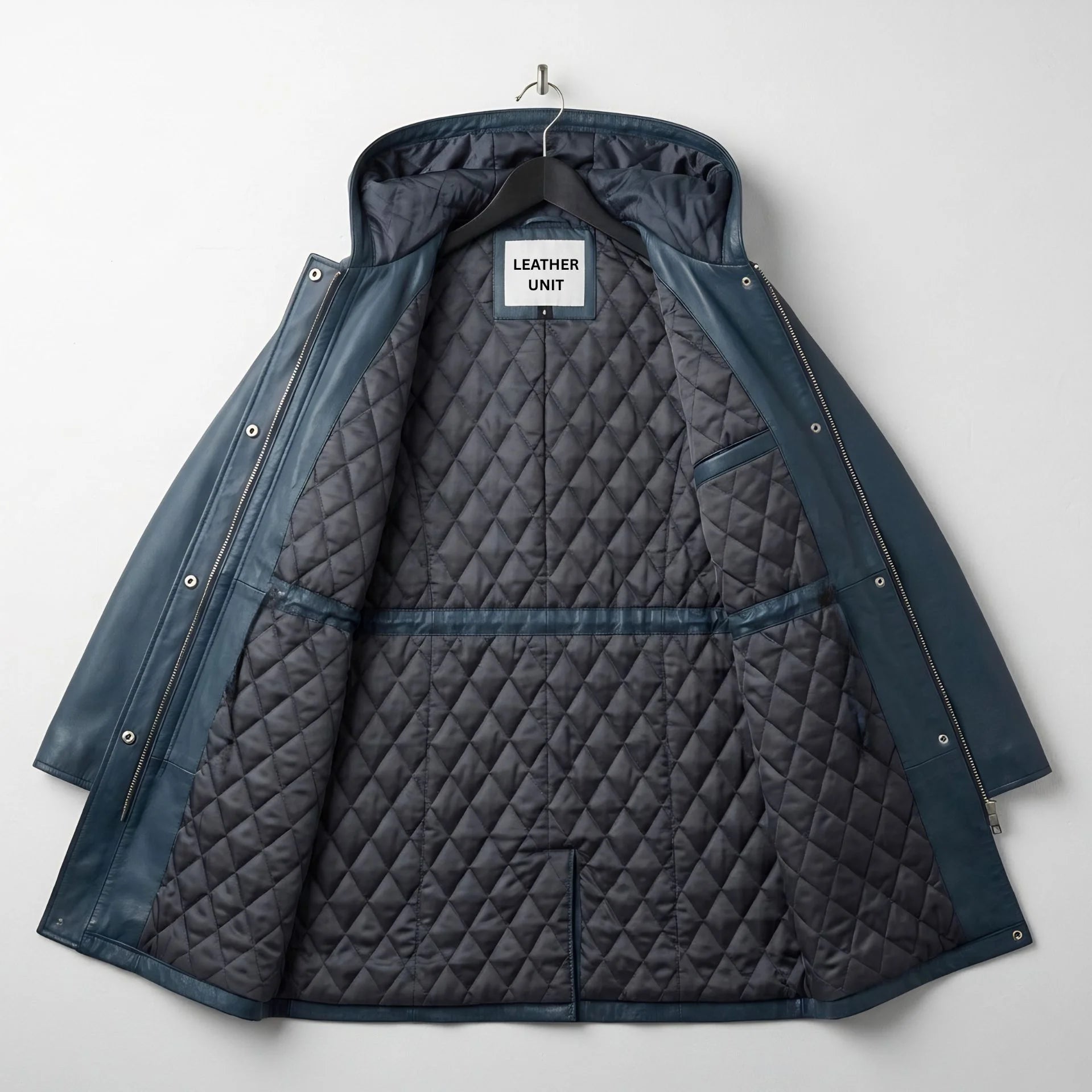 Inside quilted lining of women’s navy leather hooded coat