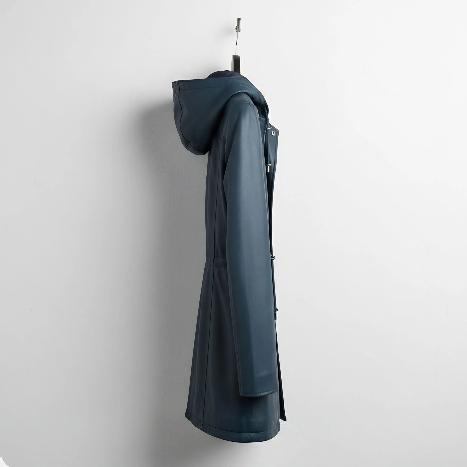 Side profile of longline navy leather hooded jacket for women