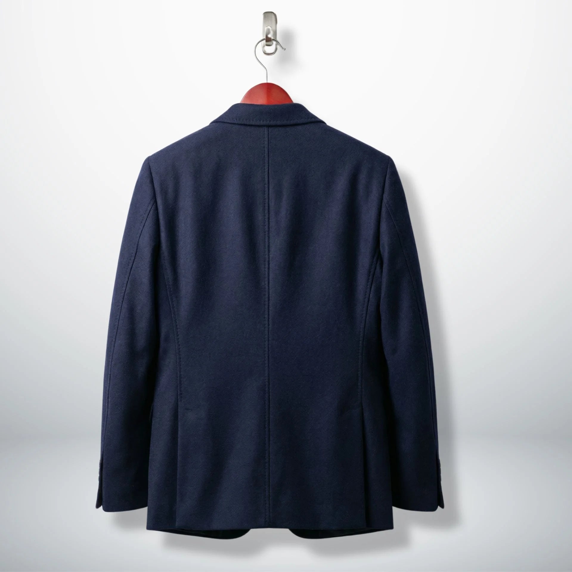 Back view of tailored women’s navy wool blazer jacket