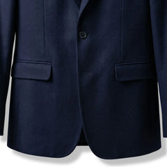 Front flap pockets and single button closure on women’s navy wool blazer