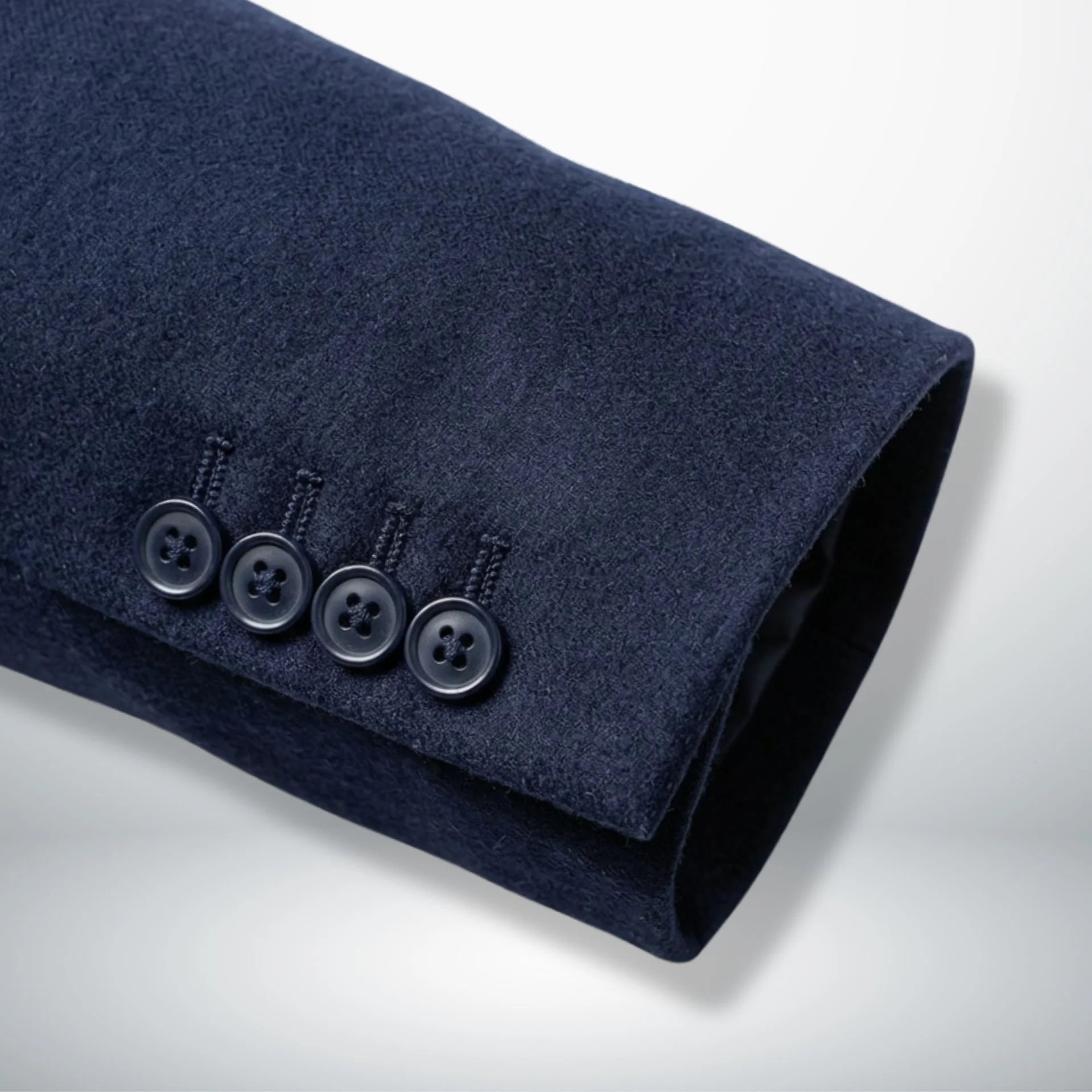 Sleeve cuff detail with four buttons on navy blue wool blazer