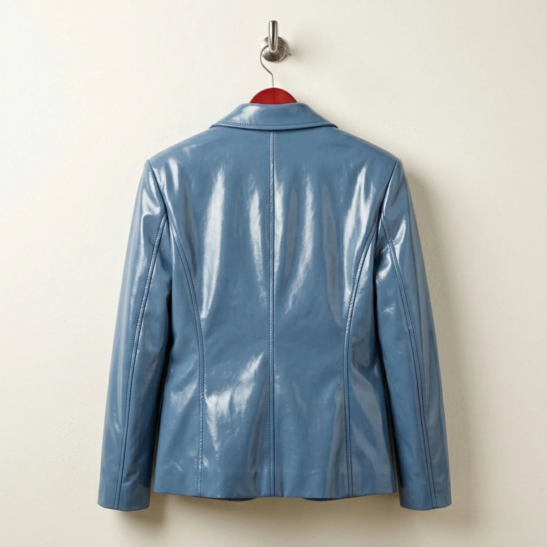 Back view of glossy sapphire blue leather blazer for women