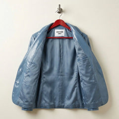 Inside lining and inner pocket of women’s sapphire blue leather blazer