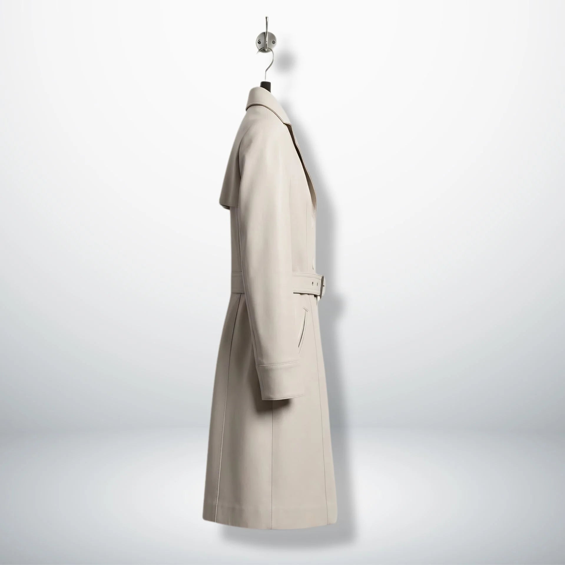 Side profile of knee length white leather trench coat for women