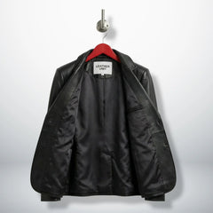 Inside lining of women’s black leather blazer showing interior pocket