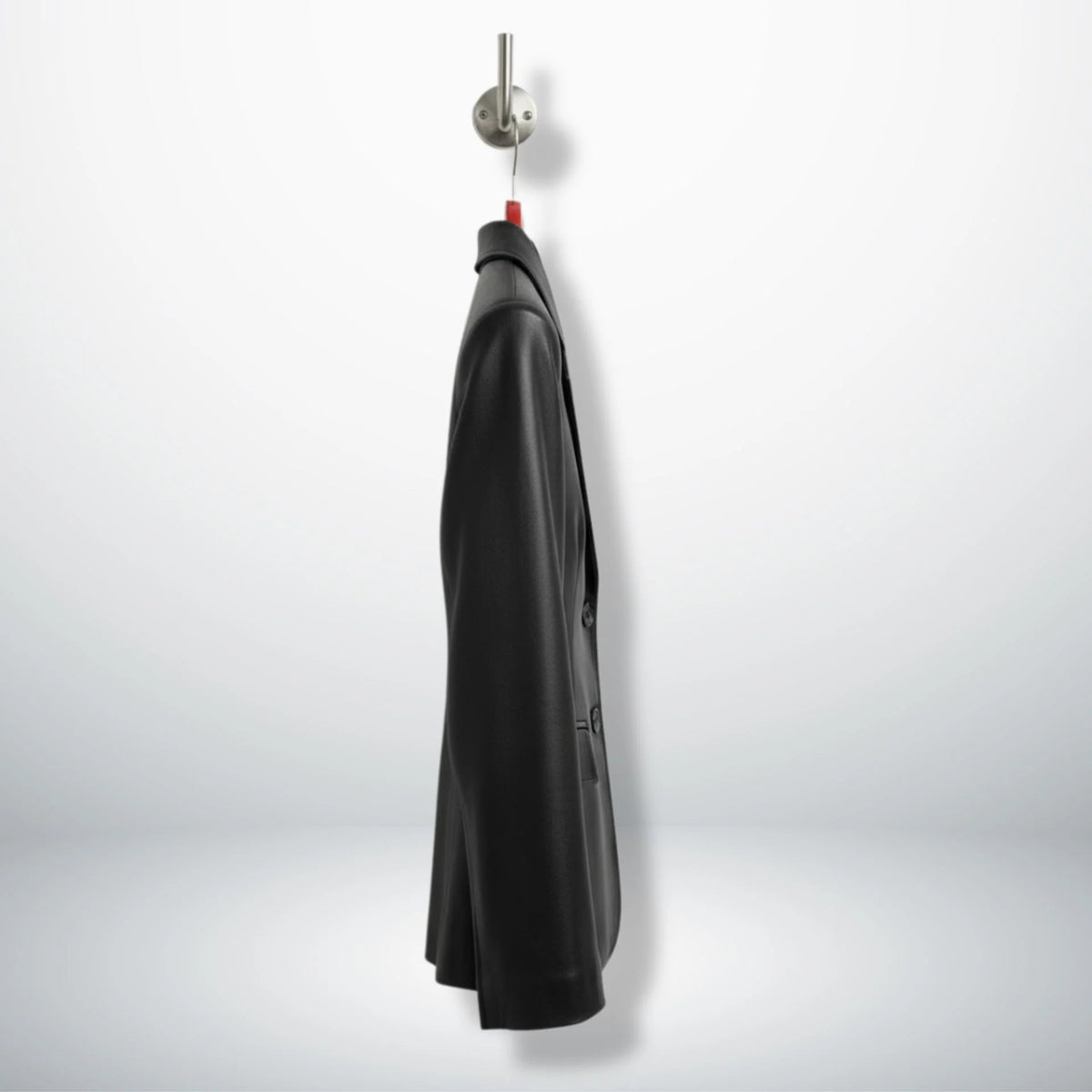Side profile of hip‑length black leather blazer for women
