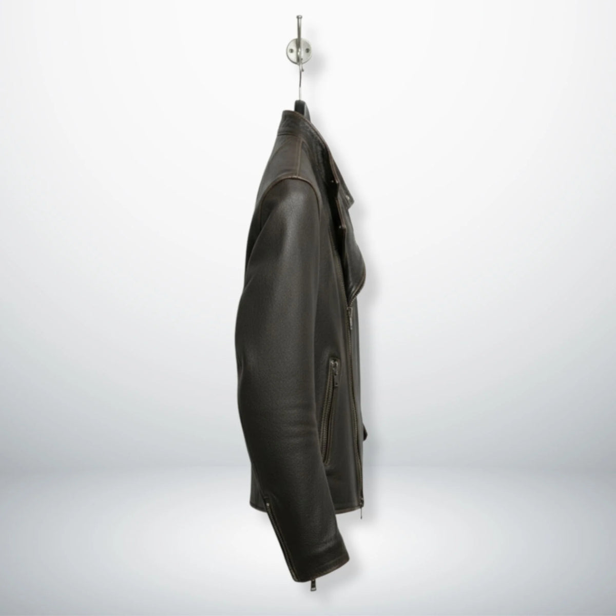 side profile of men's dark brown asymmetrical leather moto jacket.