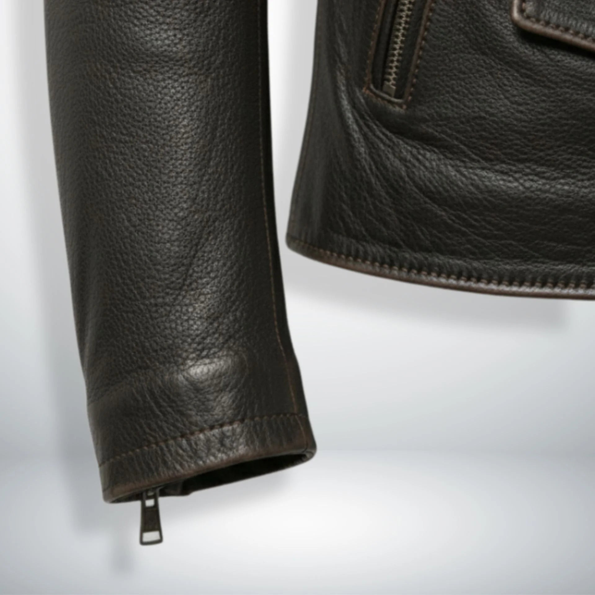 sleeve and cuff zipper detail on men's dark brown leather biker jacket.
