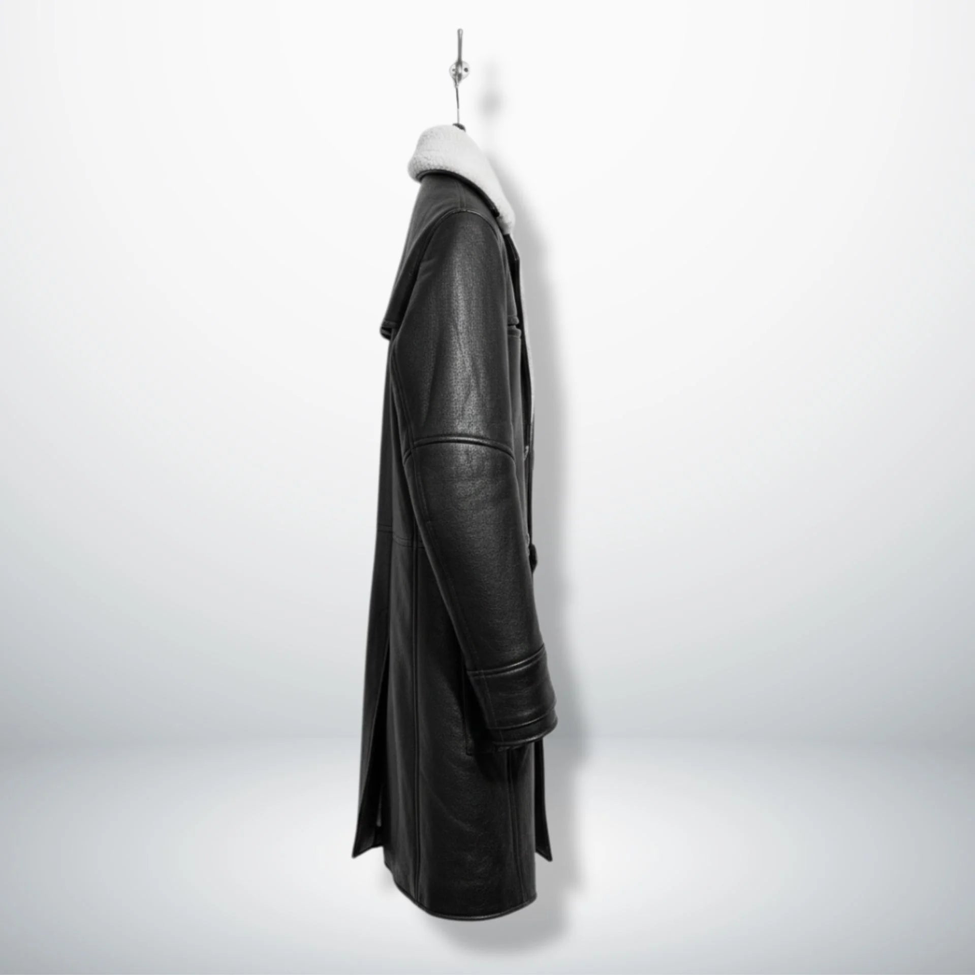 Side profile of men's black shearling trench coat with regular fit.