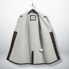 Interior of men's Bane leather coat showing full white shearling lining.