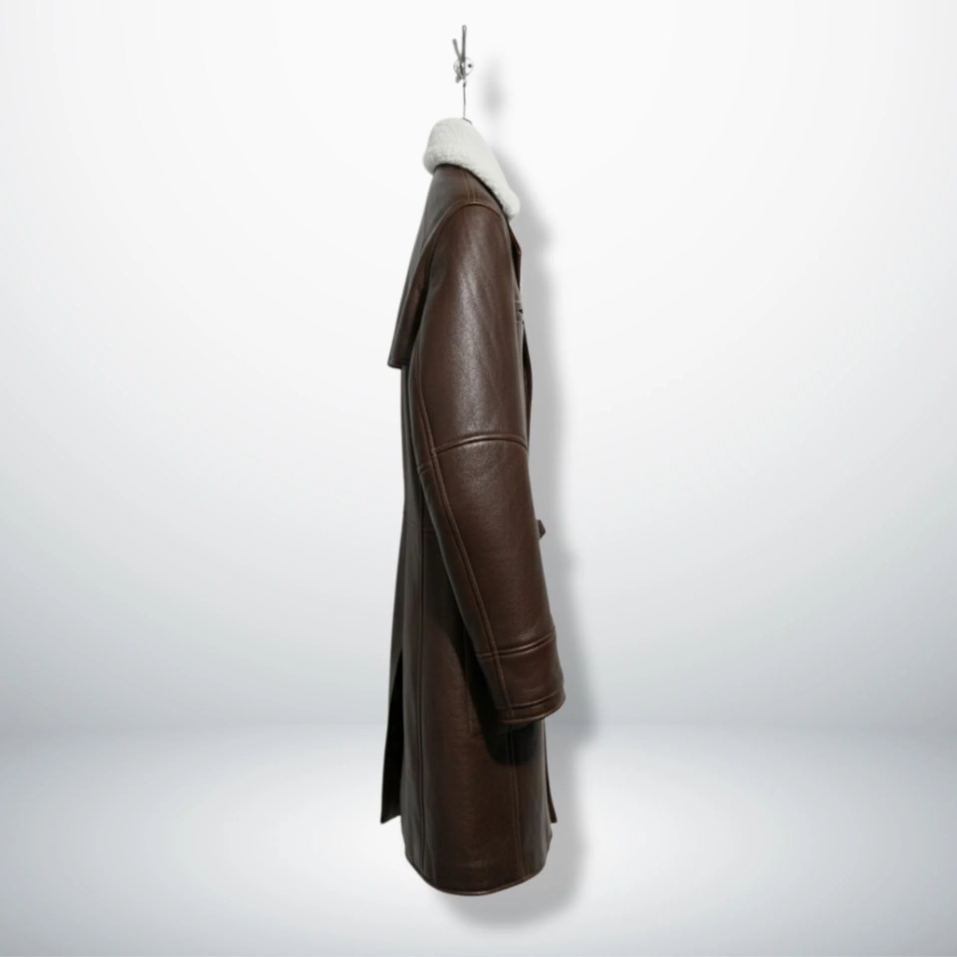 Side profile of men's dark brown shearling trench coat with regular fit.