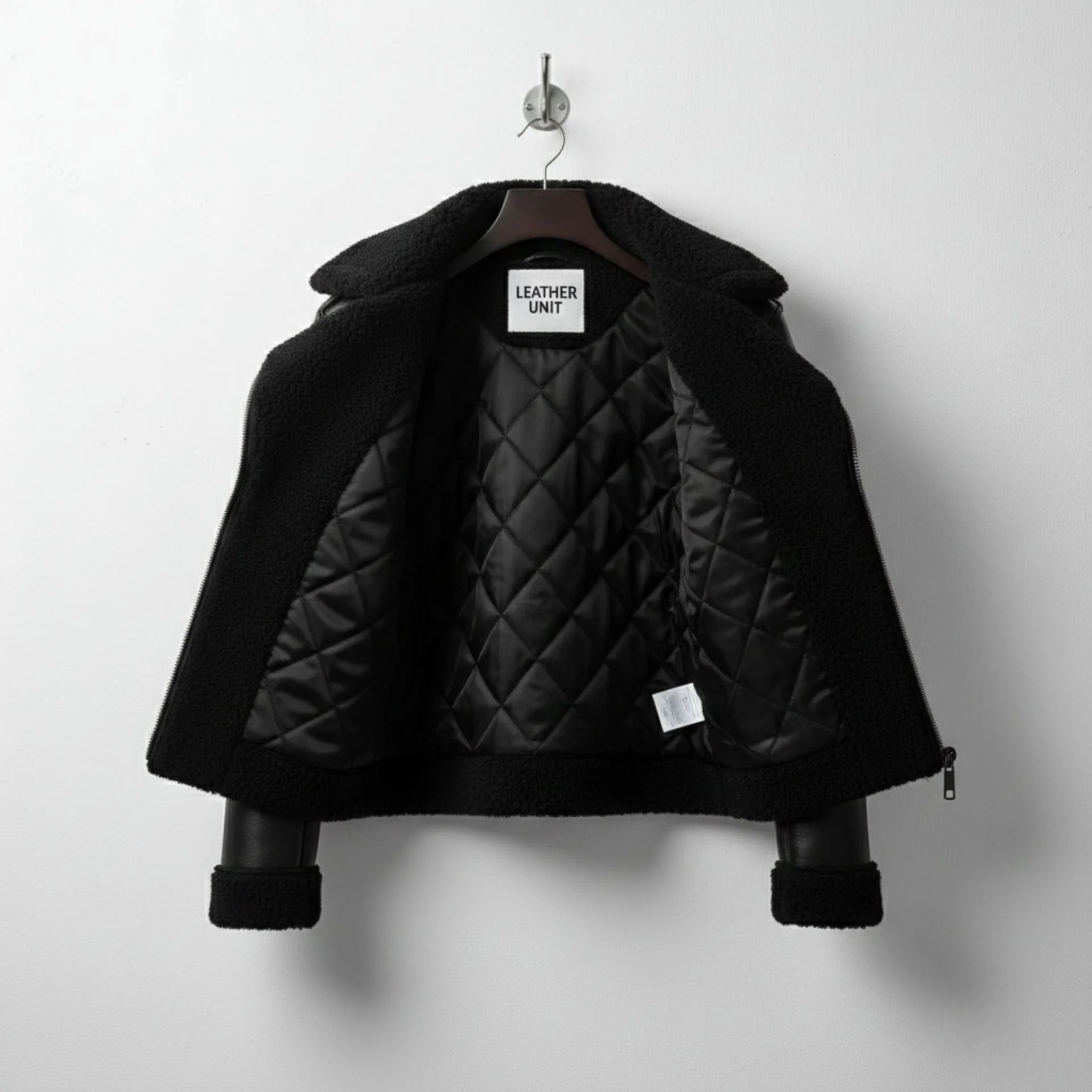 interior of mens black shearling leather jacket with quilted lining.