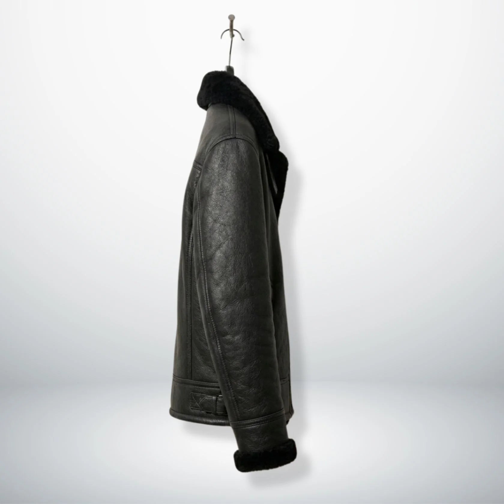 side profile mens black shearling aviator leather jacket on hanger.