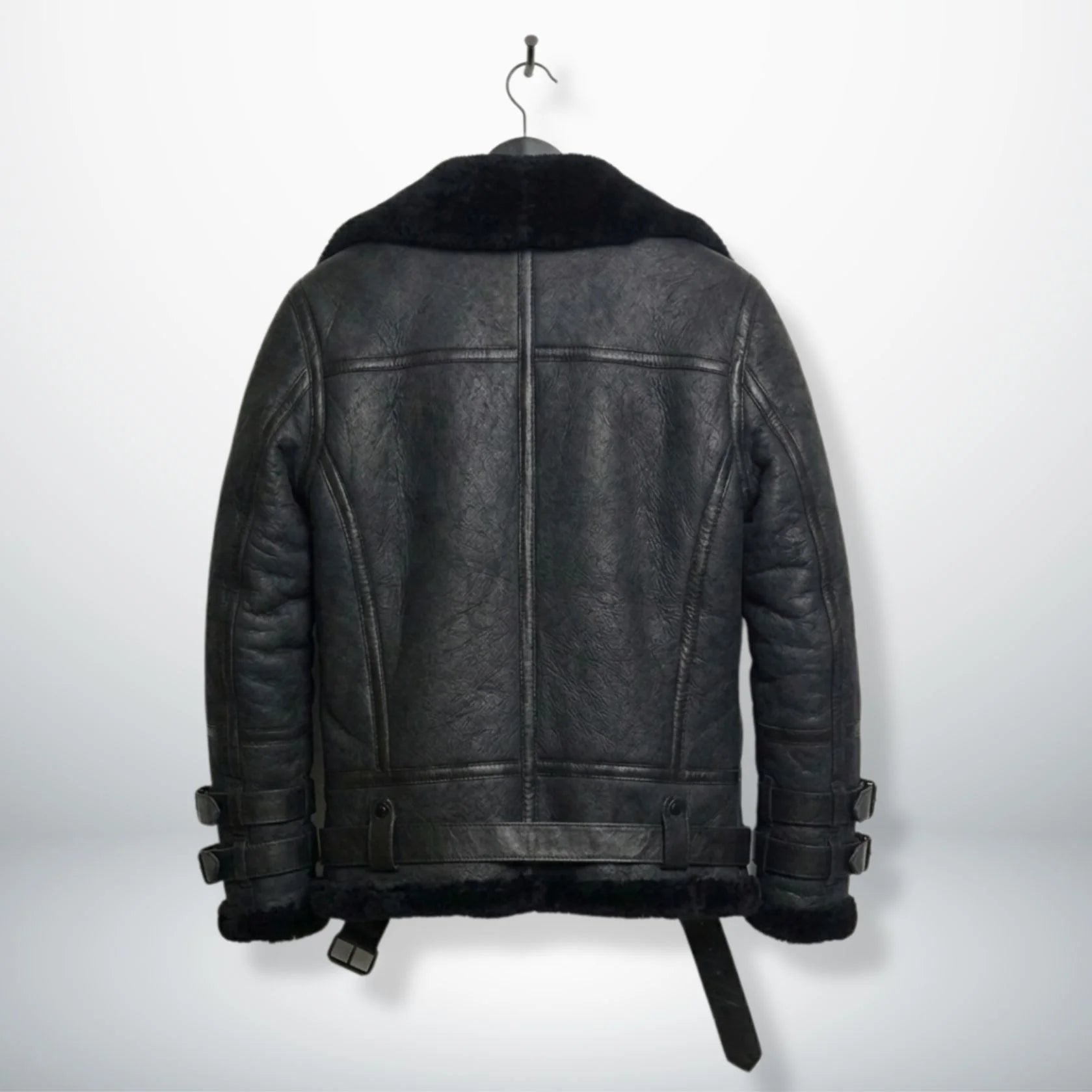 back view mens black b3 aviator leather jacket with shearling hem.