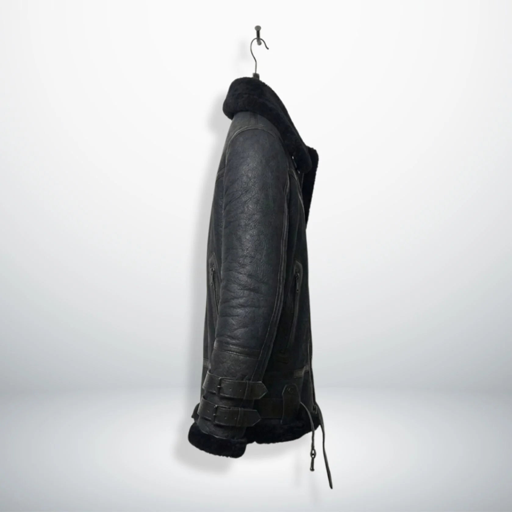 side profile mens black b3 shearling aviator jacket on hanger.