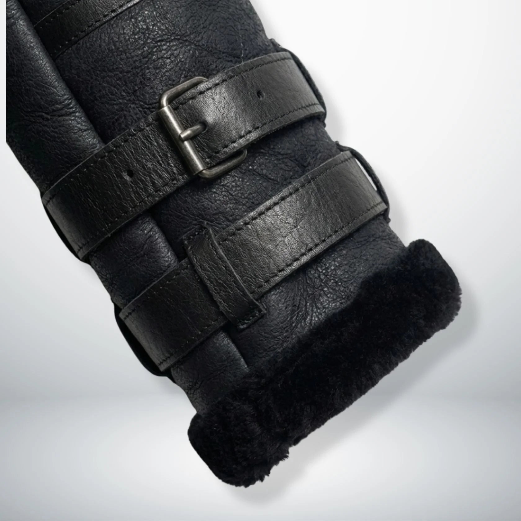 close up triple buckle cuff strap and shearling trim on b3 aviator jacket.