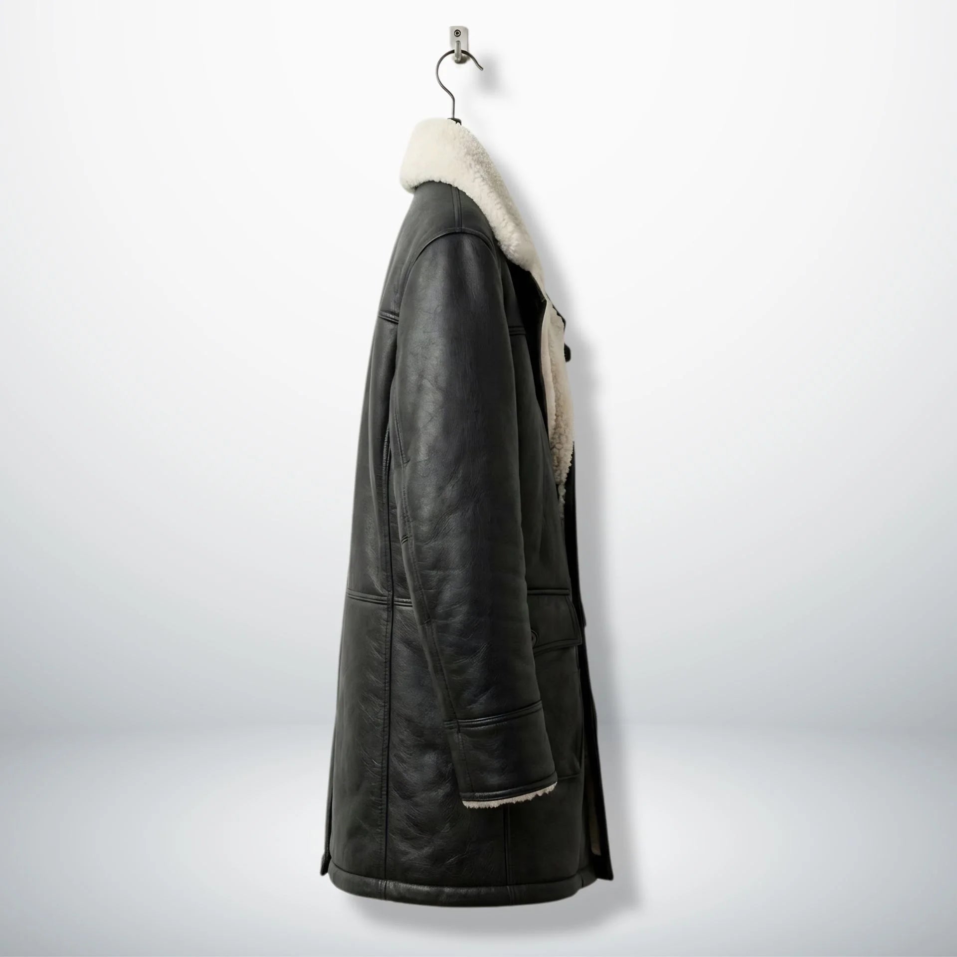 Side profile of men’s long black shearling leather coat