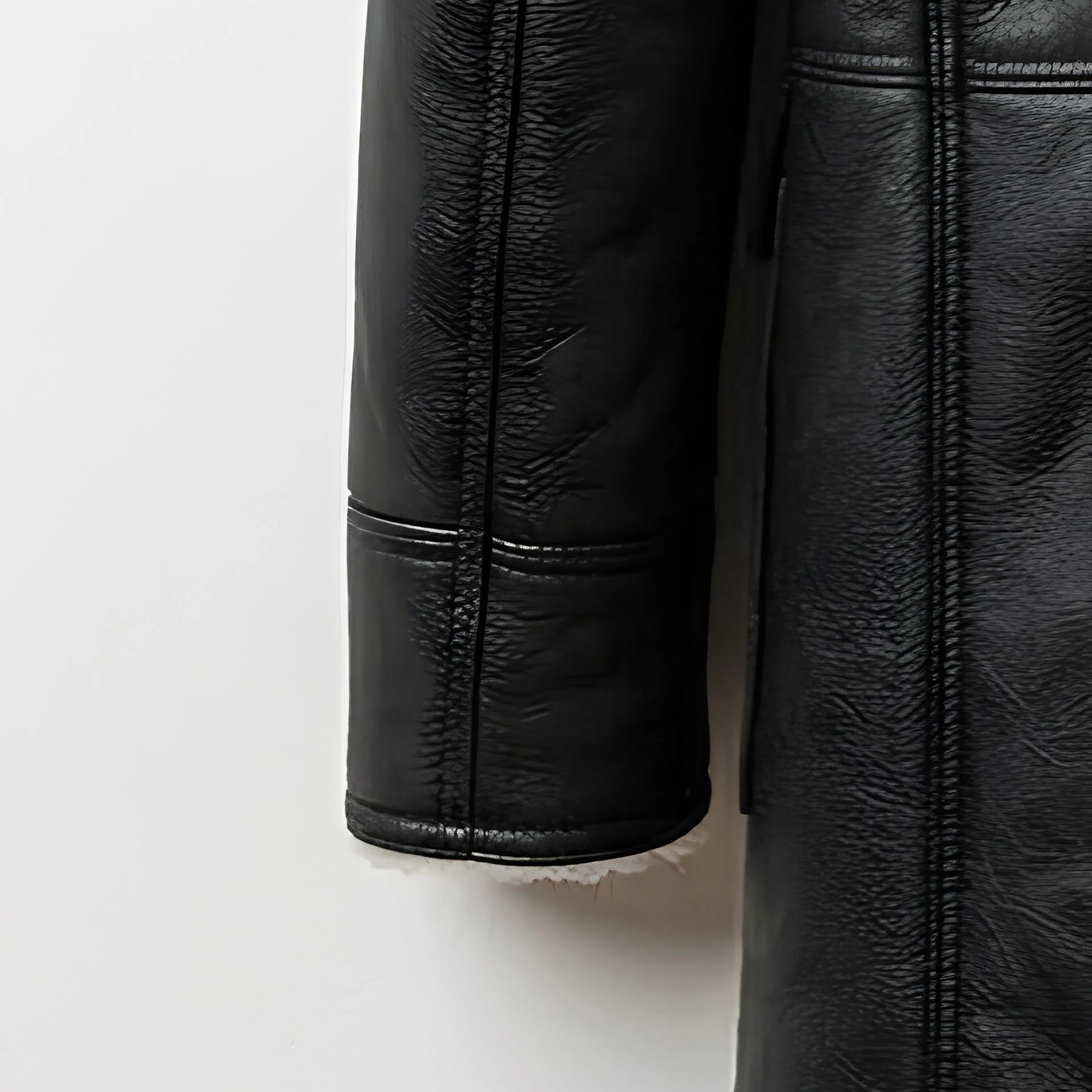 Sleeve and cuff detail on men’s black sherpa leather winter coat