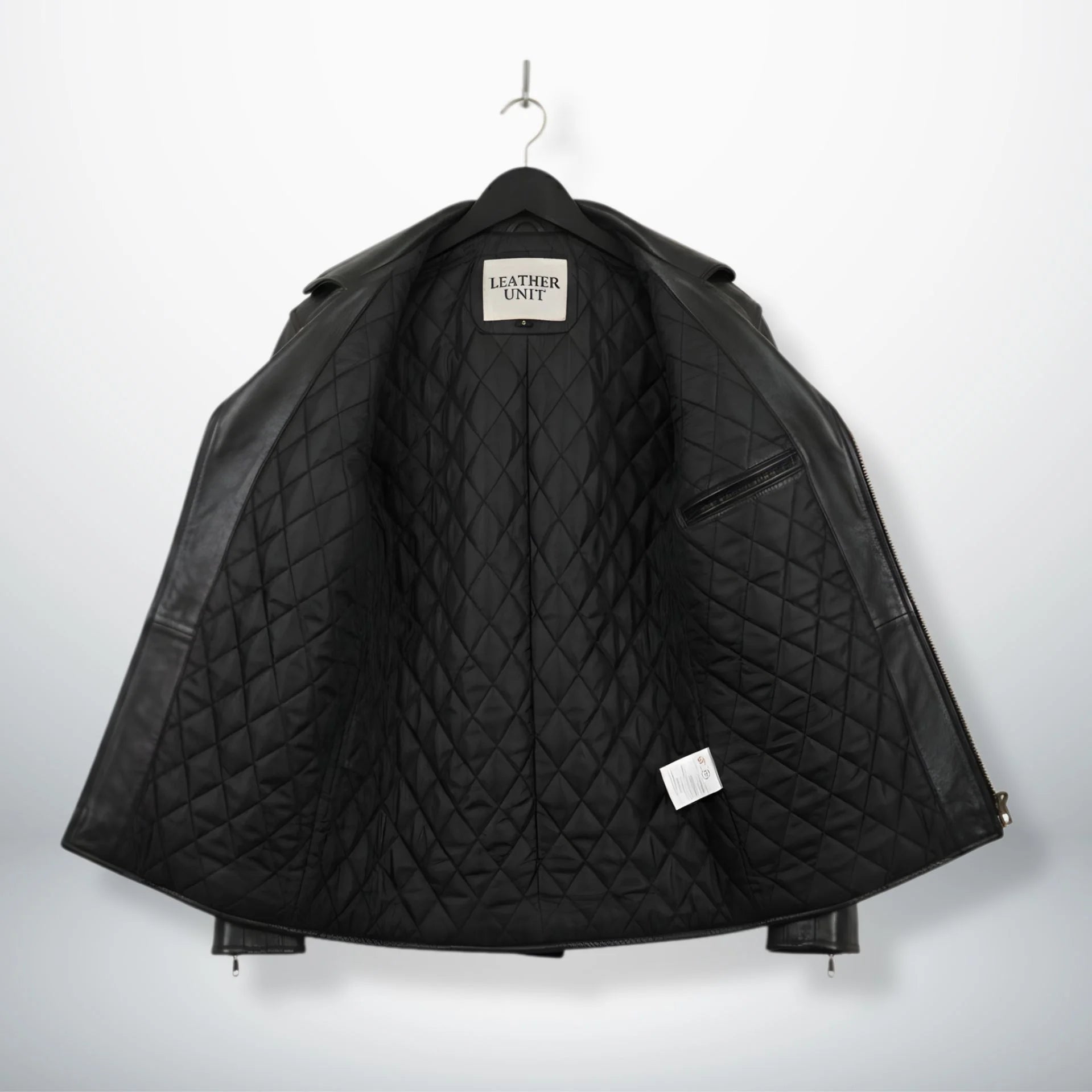 interior view black leather motorcycle coat with quilted lining and inside pocket.