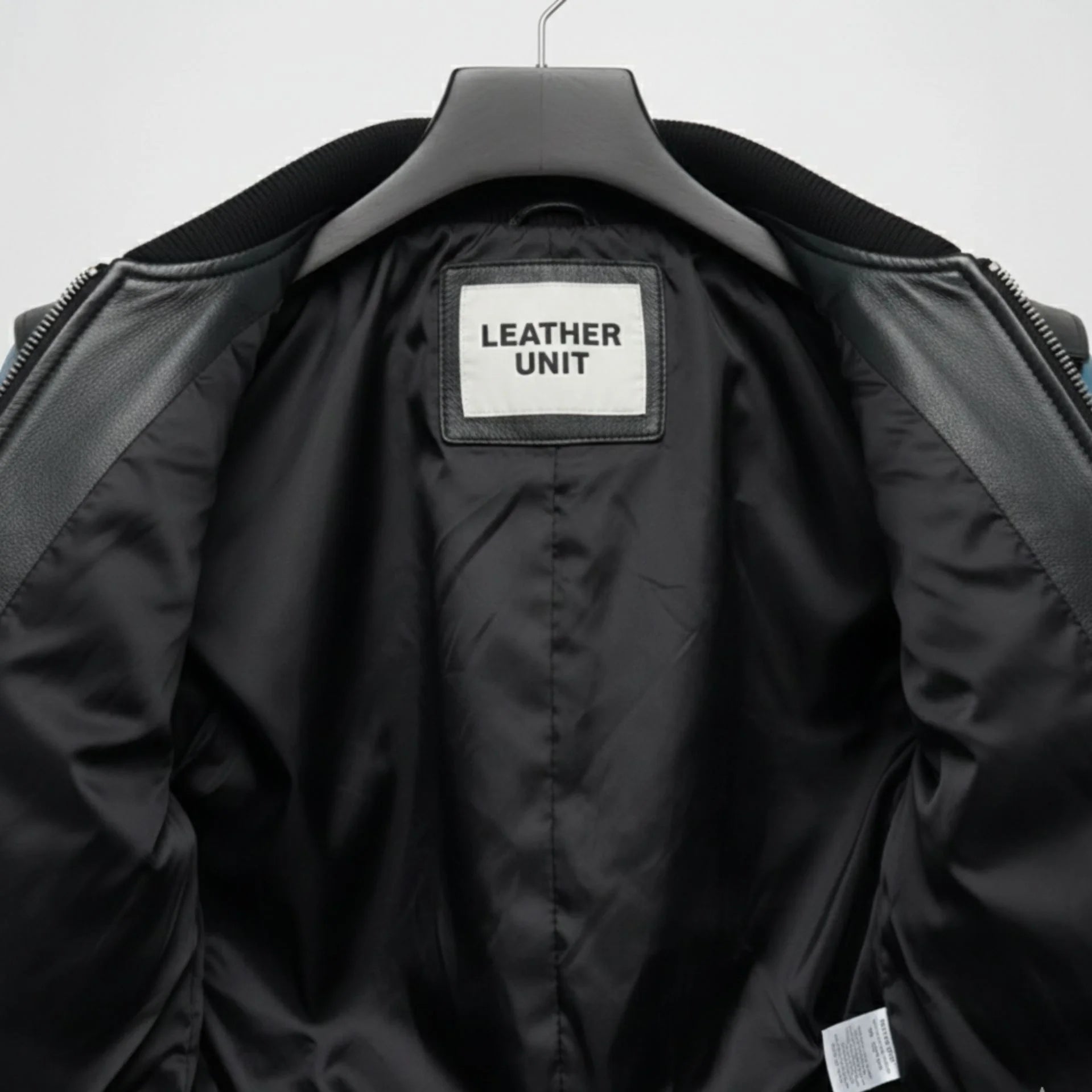 interior lining of mens black blue bomber leather jacket leather unit label.