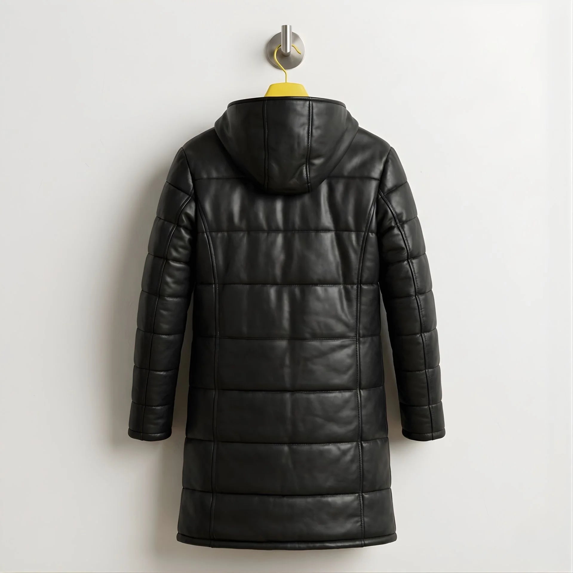 Back view of men's black leather puffer coat with attached hood.