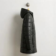 Side profile of long black leather puffer coat with hood for men.
