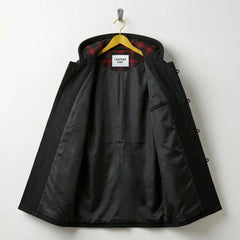 Interior of men's black duffle coat showing smooth lining and inner pocket.